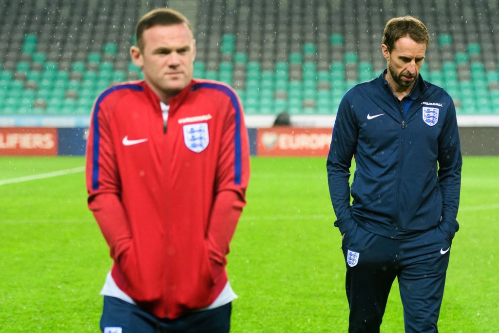 Interim England manager Gareth Southgate (R) and England's striker Wayne Rooney (L) walk on the pitch on the eve of the World Cup 2018 football qualification match between Slovenia and England in Ljubljana, on October 10, 2016 (Photo by Jure Makovec/AFP/Getty Images)