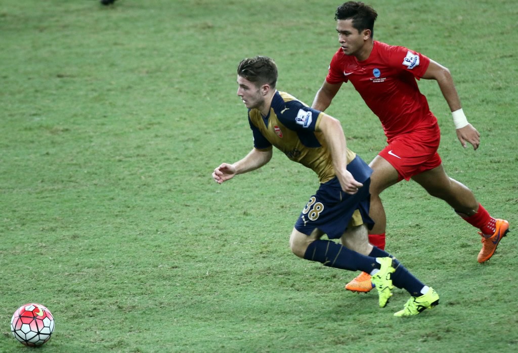 SINGAPORE - JULY 15: Dan Crowley of Arsenal competes with Zulfahmi Arifin of Singapore during the Barclays Asia Trophy match between Arsenal and Singapore at National Stadium on July 15, 2015 in Singapore. (Photo by Stanley Chou/Getty Images)
