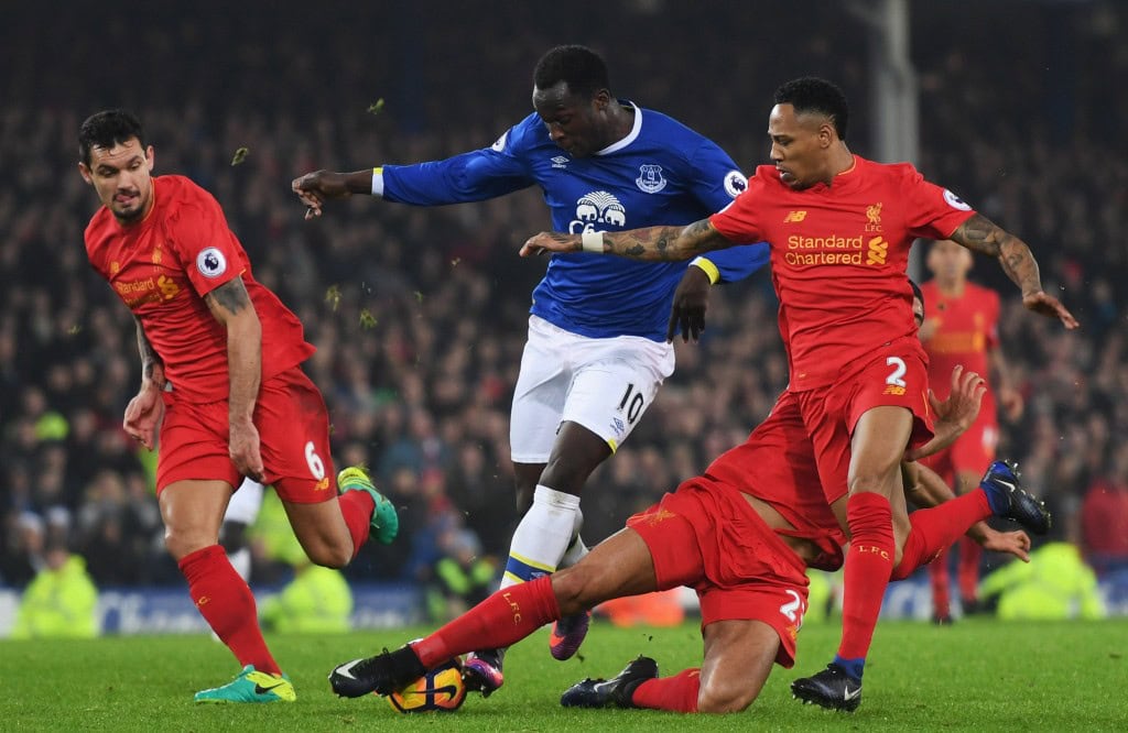 LIVERPOOL, ENGLAND - DECEMBER 19: Romelu Lukaku of Everton takes on Dejan Lovren (L), Emre Can (2R) and Nathaniel Clyne of Liverpool (R) during the Premier League match between Everton and Liverpool at Goodison Park on December 19, 2016 in Liverpool, England. (Photo by Michael Regan/Getty Images)