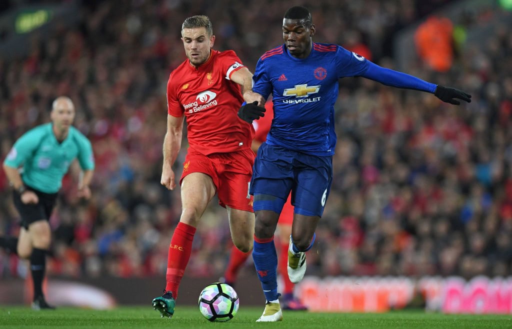 Liverpool's English midfielder Jordan Henderson vies with Manchester United's French midfielder Paul Pogba (R) during the English Premier League football match between Liverpool and Manchester United at Anfield in Liverpool, north west England on October 17, 2016. (Photo courtesy - Paul Ellis/AFP/Getty Images)