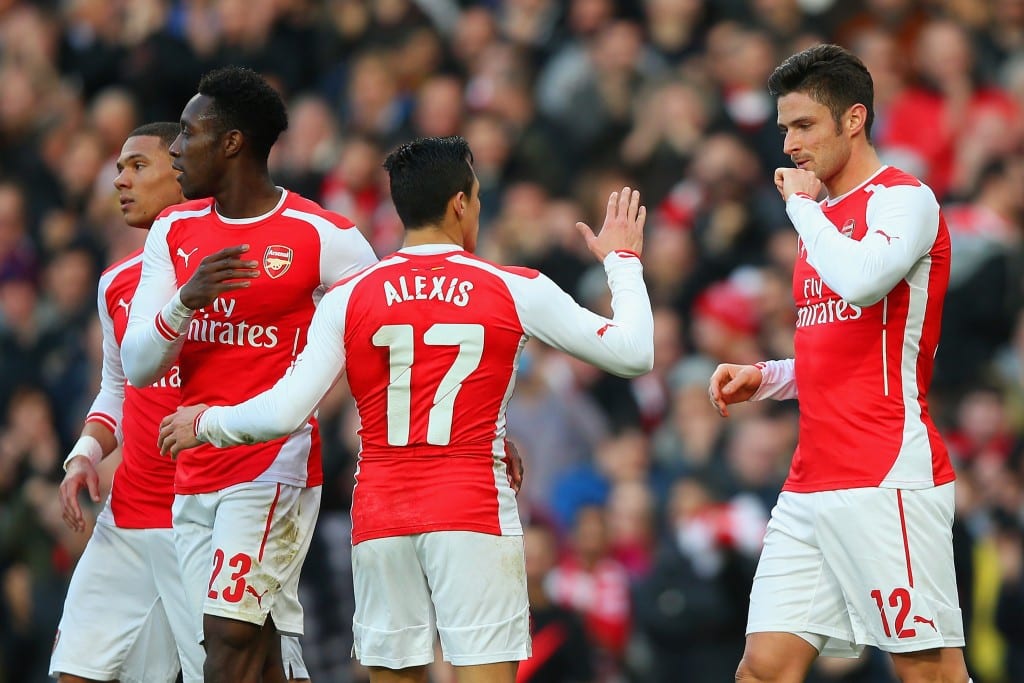 LONDON, ENGLAND - FEBRUARY 15: Olivier Giroud of Arsenal (R) celebrates with Alexis Sanchez and Danny Welbeck of Arsenal after scoring the opening goal during the FA Cup fifth round match between Arsenal and Middlesbrough at Emirates Stadium on February 15, 2015 in London, England. (Photo by Paul Gilham/Getty Images)