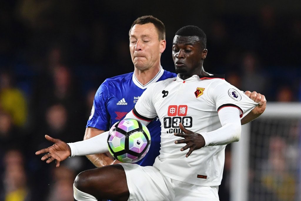 Watford's French striker M'Baye Niang (R) tries to hold off Chelsea's English defender John Terry (L) during the English Premier League football match between Chelsea and Watford at Stamford Bridge in London on May 15, 2017. / AFP PHOTO / Ben STANSALL / RESTRICTED TO EDITORIAL USE. No use with unauthorized audio, video, data, fixture lists, club/league logos or 'live' services. Online in-match use limited to 75 images, no video emulation. No use in betting, games or single club/league/player publications. / (Photo credit should read BEN STANSALL/AFP/Getty Images)
