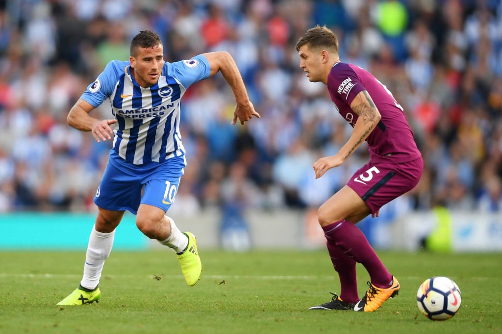 BRIGHTON, ENGLAND - AUGUST 12: Tomer Hemed of Brighton and Hove Albion attempts to get past John Stones of Manchester City during the Premier League match between Brighton and Hove Albion and Manchester City at the Amex Stadium on August 12, 2017 in Brighton, England. (Photo by Mike Hewitt/Getty Images)