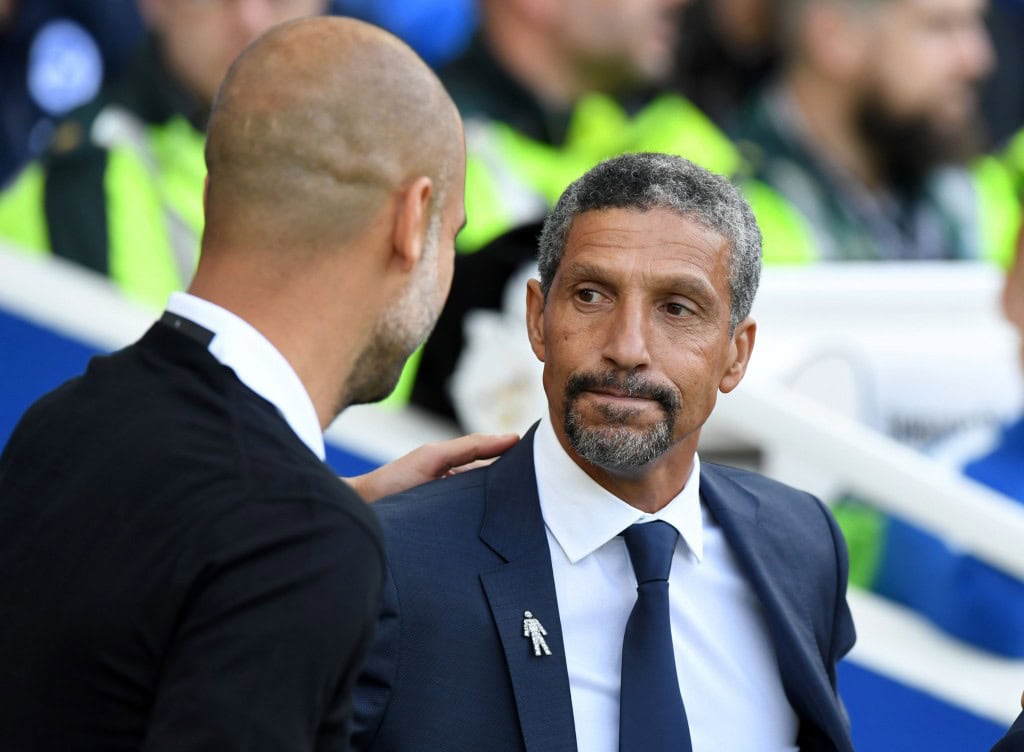 Brighton's Irish manager Chris Hughton (R) greets Manchester City's Spanish manager Pep Guardiola ahead of the English Premier League football match between Brighton and Hove Albion and Manchester City at the American Express Community Stadium in Brighton, southern England on August 12, 2017. / AFP PHOTO / CHRIS J RATCLIFFE / RESTRICTED TO EDITORIAL USE. No use with unauthorized audio, video, data, fixture lists, club/league logos or 'live' services. Online in-match use limited to 75 images, no video emulation. No use in betting, games or single club/league/player publications. / (Photo credit should read CHRIS J RATCLIFFE/AFP/Getty Images)