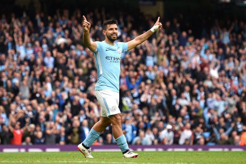 Manchester City's Argentinian striker Sergio Aguero celebrates after scoring their fourth goal during the English Premier League football match between Manchester City and Crystal Palace at the Etihad Stadium in Manchester, north west England, on September 23, 2017. / AFP PHOTO / Oli SCARFF / RESTRICTED TO EDITORIAL USE. No use with unauthorized audio, video, data, fixture lists, club/league logos or 'live' services. Online in-match use limited to 75 images, no video emulation. No use in betting, games or single club/league/player publications. / (Photo credit should read OLI SCARFF/AFP/Getty Images)