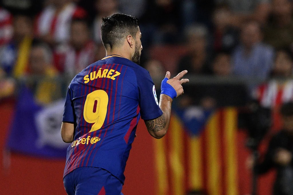 Barcelona's forward from Uruguay Luis Suarez celebrates after scoring during the Spanish league football match Girona FC vs FC Barcelona at the Montilivi stadium in Girona on September 23, 2017. / AFP PHOTO / Josep LAGO (Photo credit should read JOSEP LAGO/AFP/Getty Images)