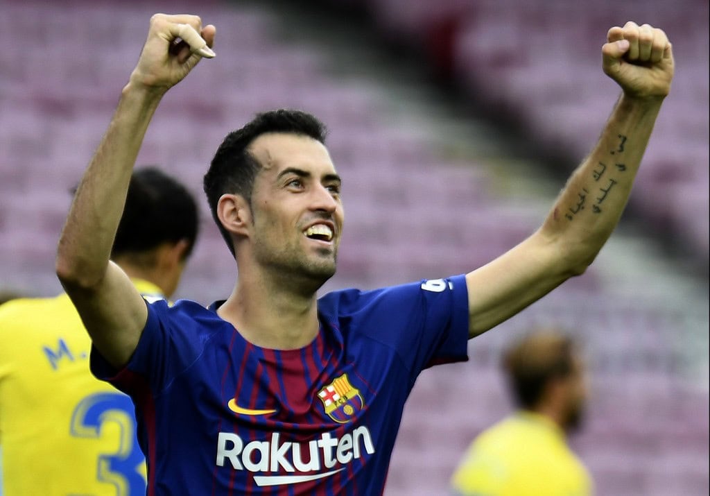 Barcelona's Spanish midfielder Sergio Busquets celebrates after scoring a goal during the Spanish league football match FC Barcelona vs UD Las Palmas played behind closed doors at the Camp Nou stadium in Barcelona on October 1, 2017. / AFP PHOTO / JOSE JORDAN (Photo credit should read JOSE JORDAN/AFP/Getty Images)