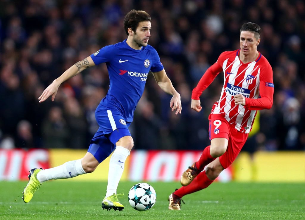 LONDON, ENGLAND - DECEMBER 05: Cesc Fabregas of Chelsea and Fernando Torres of Atletico Madrid in action during the UEFA Champions League group C match between Chelsea FC and Atletico Madrid at Stamford Bridge on December 5, 2017 in London, United Kingdom. (Photo by Clive Rose/Getty Images)
