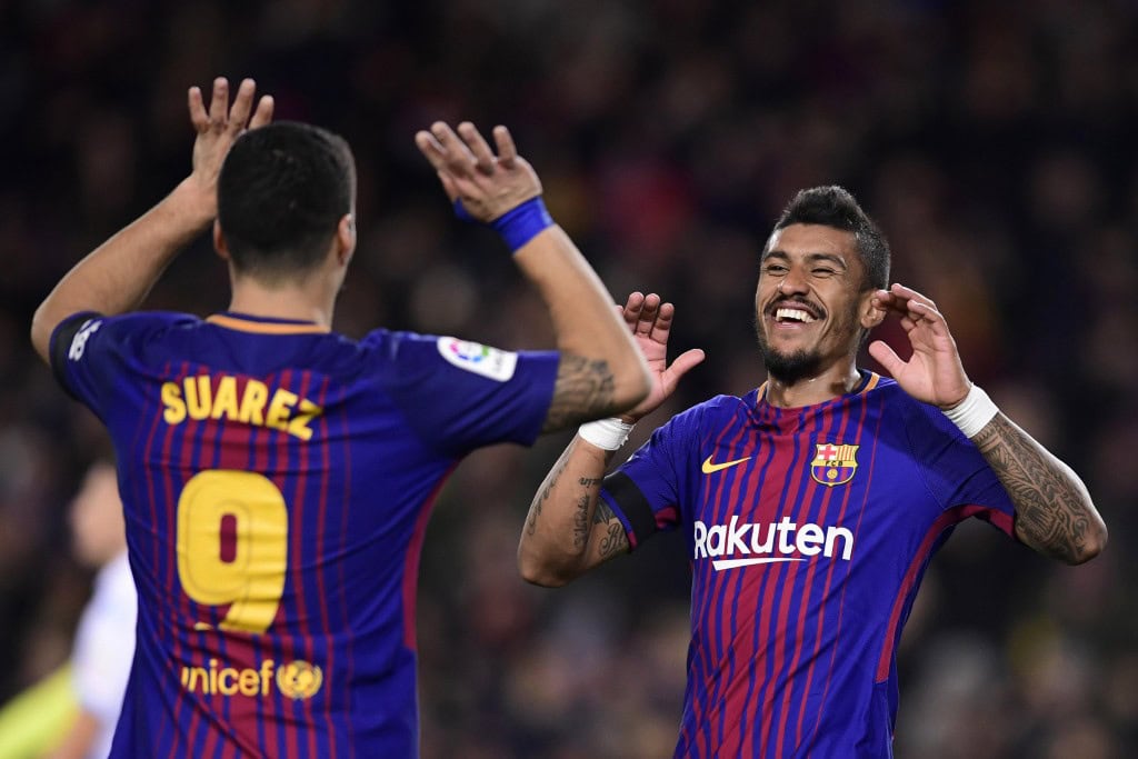 Barcelona's Brazilian midfielder Paulinho (R) celebrates with Barcelona's Uruguayan forward Luis Suarez after scoring during the Spanish league football match FC Barcelona against RC Deportivo de la Coruna at the Camp Nou stadium in Barcelona on December 17, 2017. / AFP PHOTO / JAVIER SORIANO (Photo credit should read JAVIER SORIANO/AFP/Getty Images)