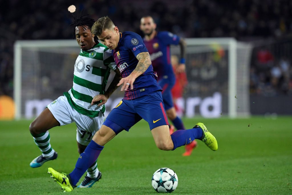 Barcelona's French defender Lucas Digne (R) challenges Sporting's Portuguese forward Gelson Martins during the UEFA Champions League football match FC Barcelona vs Sporting CP at the Camp Nou stadium in Barcelona on December 5, 2017. / AFP PHOTO / LLUIS GENE (Photo credit should read LLUIS GENE/AFP/Getty Images)