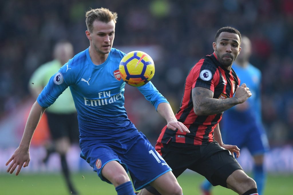 BOURNEMOUTH, ENGLAND - JANUARY 14: Rob Holding of Arsenal is challenged by Callum Wilson of Bournemouth during the Premier League match between AFC Bournemouth and Arsenal at Vitality Stadium on January 14, 2018 in Bournemouth, England. (Photo by Mike Hewitt/Getty Images)