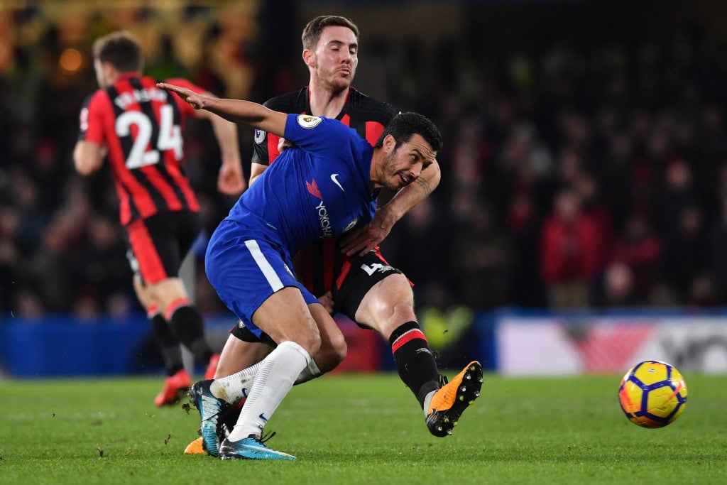 Chelsea's Spanish midfielder Pedro (R) vies with Bournemouth's English midfielder Dan Gosling during the English Premier League football match between Chelsea and Bournemouth at Stamford Bridge in London on January 31, 2018. / AFP PHOTO / Ben STANSALL / RESTRICTED TO EDITORIAL USE. No use with unauthorized audio, video, data, fixture lists, club/league logos or 'live' services. Online in-match use limited to 75 images, no video emulation. No use in betting, games or single club/league/player publications. / (Photo credit should read BEN STANSALL/AFP/Getty Images)