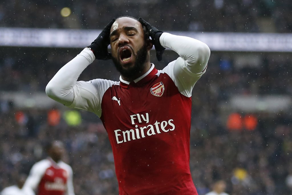 Arsenal's French striker Alexandre Lacazette reacts after missing a chance during the English Premier League football match between Tottenham Hotspur and Arsenal at Wembley Stadium in London, on February 10, 2018. / AFP PHOTO / IKIMAGES / Ian KINGTON / RESTRICTED TO EDITORIAL USE. No use with unauthorized audio, video, data, fixture lists, club/league logos or 'live' services. Online in-match use limited to 45 images, no video emulation. No use in betting, games or single club/league/player publications. / (Photo credit should read IAN KINGTON/AFP/Getty Images)