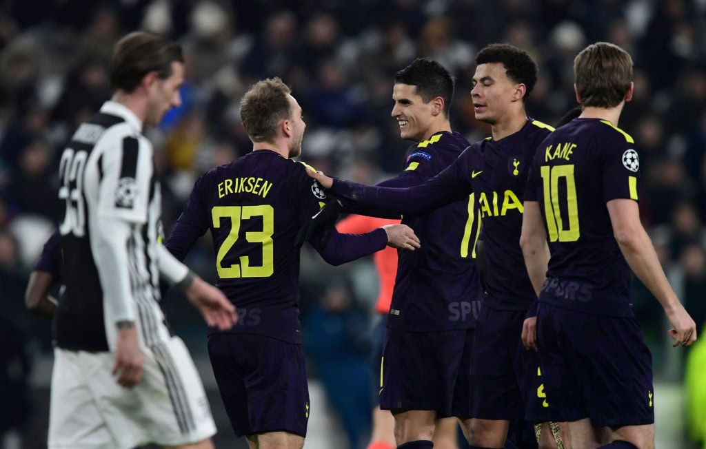 Tottenham Hotspur's Danish midfielder Christian Eriksen (C) is congratulated by teammate English midfielder Dele Alli (2R) during the UEFA Champions League round of sixteen first leg football match between Juventus and Tottenham Hotspur at The Allianz Stadium in Turin on February 13, 2018. / AFP PHOTO / Miguel MEDINA (Photo credit should read MIGUEL MEDINA/AFP/Getty Images)