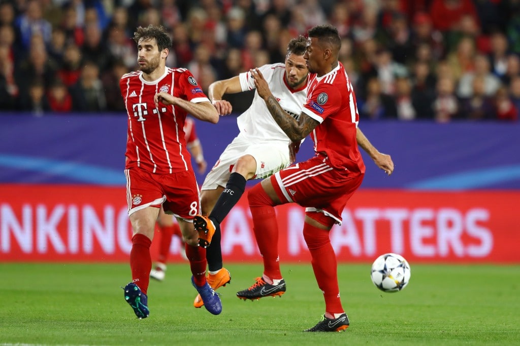 SEVILLE, SPAIN - APRIL 03: Javi Martinez of Bayern Muenchen and Jerome Boateng of Bayern Muenchen attempt to block Franco Vazquez of Sevilla shot during the UEFA Champions League Quarter Final Leg One match between Sevilla FC and Bayern Muenchen at Estadio Ramon Sanchez Pizjuan on April 3, 2018 in Seville, Spain. (Photo by Martin Rose/Bongarts/Getty Images)