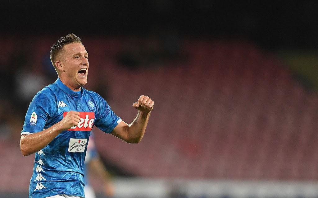 NAPLES, ITALY - AUGUST 25: Piotr Zielinski of SSC Napoli celebrates after scoring the 2-2 goal during the serie A match between SSC Napoli and AC Milan at Stadio San Paolo on August 25, 2018 in Naples, Italy. (Photo by Francesco Pecoraro/Getty Images)