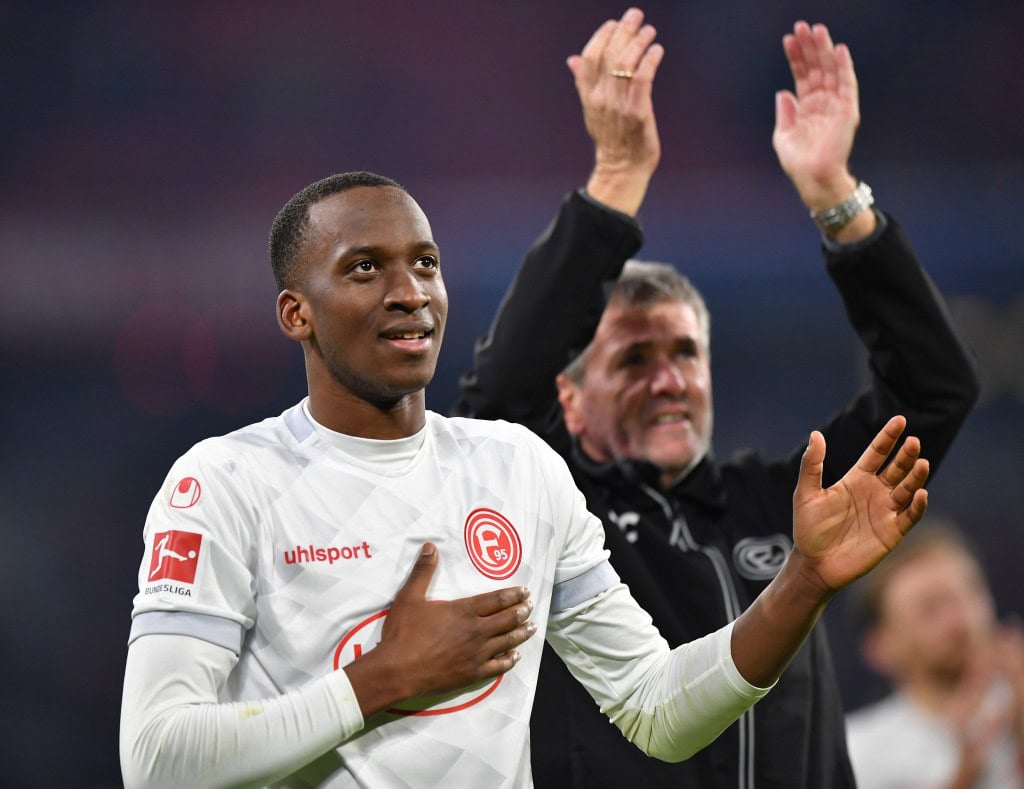 MUNICH, GERMANY - NOVEMBER 24: Dodi Lukebakio of Duesseldorf celebrates with fans after the Bundesliga match between FC Bayern Muenchen and Fortuna Duesseldorf at Allianz Arena on November 24, 2018 in Munich, Germany. (Photo by Sebastian Widmann/Bongarts/Getty Images)