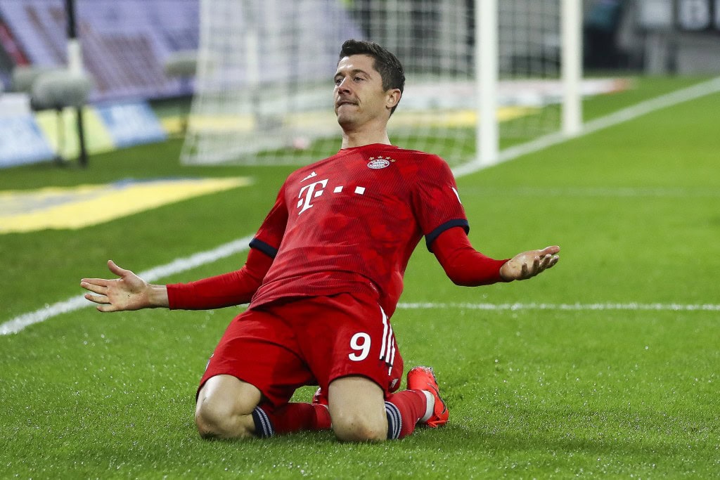 MOENCHENGLADBACH, GERMANY - MARCH 02: Robert Lewandowski #9 of Bayern Munich celebrates after scoring his team's third goal during the Bundesliga match between Borussia Moenchengladbach and FC Bayern Muenchen at Borussia-Park on March 02, 2019 in Moenchengladbach, Germany. (Photo by Maja Hitij/Bongarts/Getty Images)