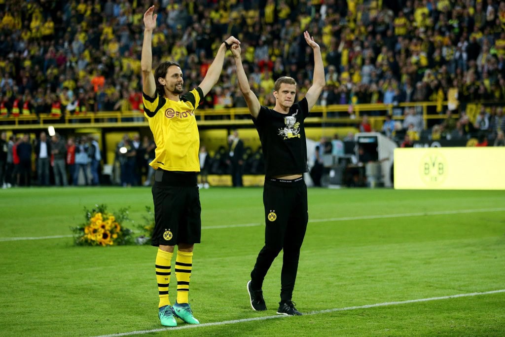DORTMUND, GERMANY - SEPTEMBER 07: (L-R) Neven Subotic and Sven Bender of Dortmund say farewell to the fans during the Roman Weidenfeller Farewell Match between Borussia Dortmund Allstars and Roman and Friends at Signal Iduna Park on September 7, 2018 in Dortmund, Germany. (Photo by Christof Koepsel/Bongarts/Getty Images)
