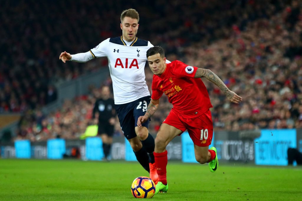 LIVERPOOL, ENGLAND - FEBRUARY 11: Philippe Coutinho of Liverpool and Christian Eriksen of Tottenham Hotspur compete for the ball during the Premier League match between Liverpool and Tottenham Hotspur at Anfield on February 11, 2017 in Liverpool, England. (Photo by Clive Brunskill/Getty Images)