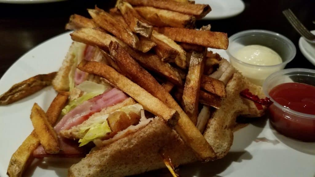 Jackie Ray's Turkey Bacon Club Piled with Fries