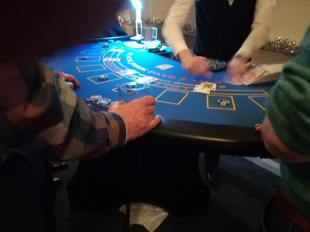 Blackjack Table with dealer in action.