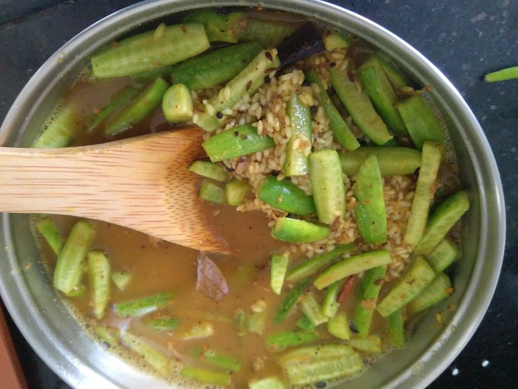 Adding water for pressure cooking the tondli bhaat