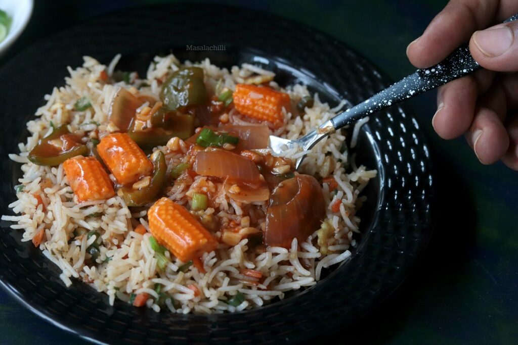 Vegetables in hot garlic sauce served with vegetable fried rice
