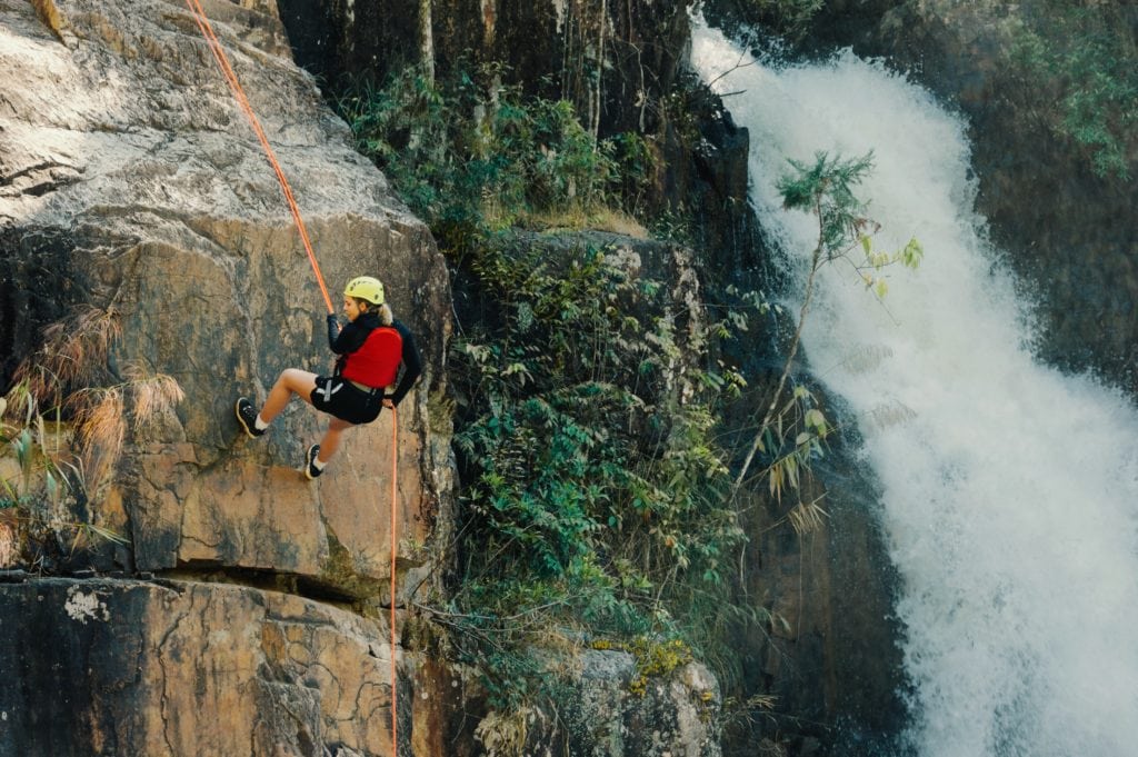woman climbing rope
