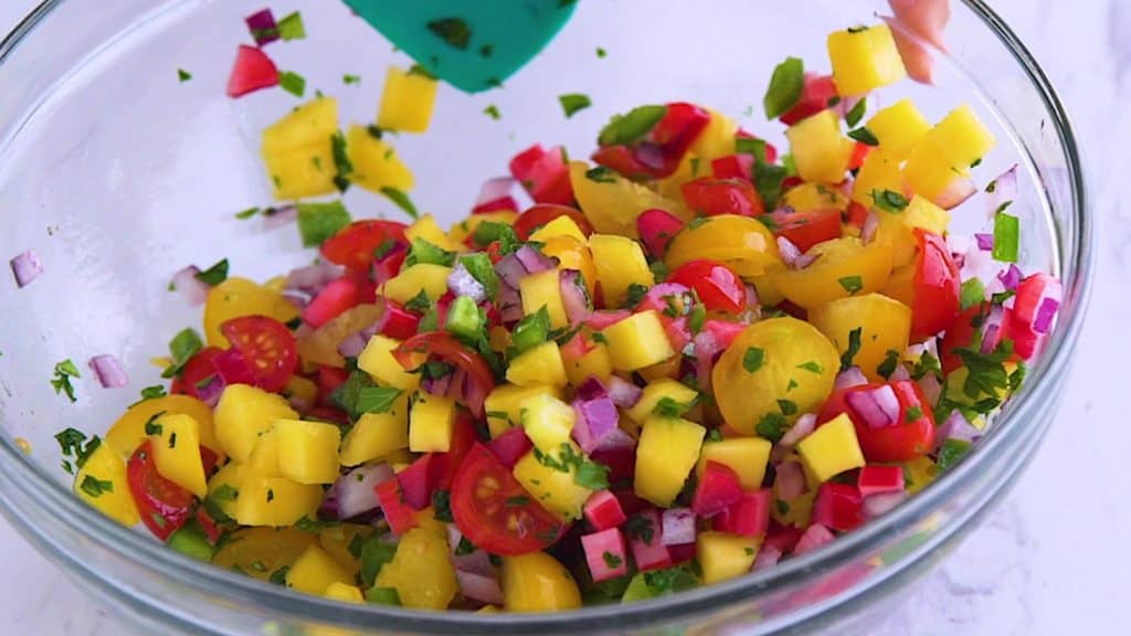 Almond crusted tilapia with mango salsa, skillet dinners, tilapia dinner ideas, pan seared parmesan crusted tilapia, easy tilapia recipes, healthy one pan meals, cooking tilapia, healthy dinners for two, sauteed tilapia