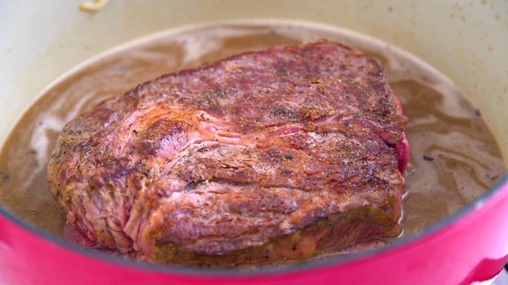 Easy Dutch oven pot roast recipe, slow cooker pot roast, beef pot roast in oven, cooking pot roast in dutch oven, pot roast with potatoes and carrots, beef chuck pot roast, one pot recipes