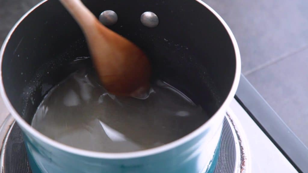 Stir to form hot sugar syrup