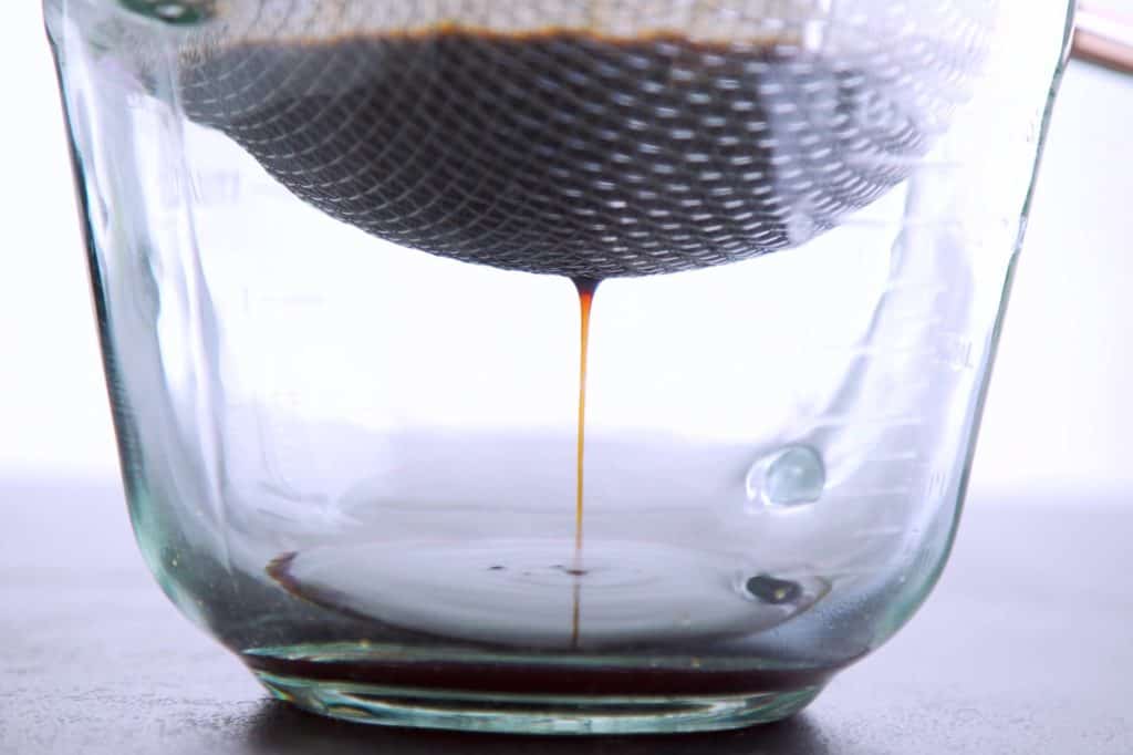 Allow cold brew coffee concentrate to strain completely
