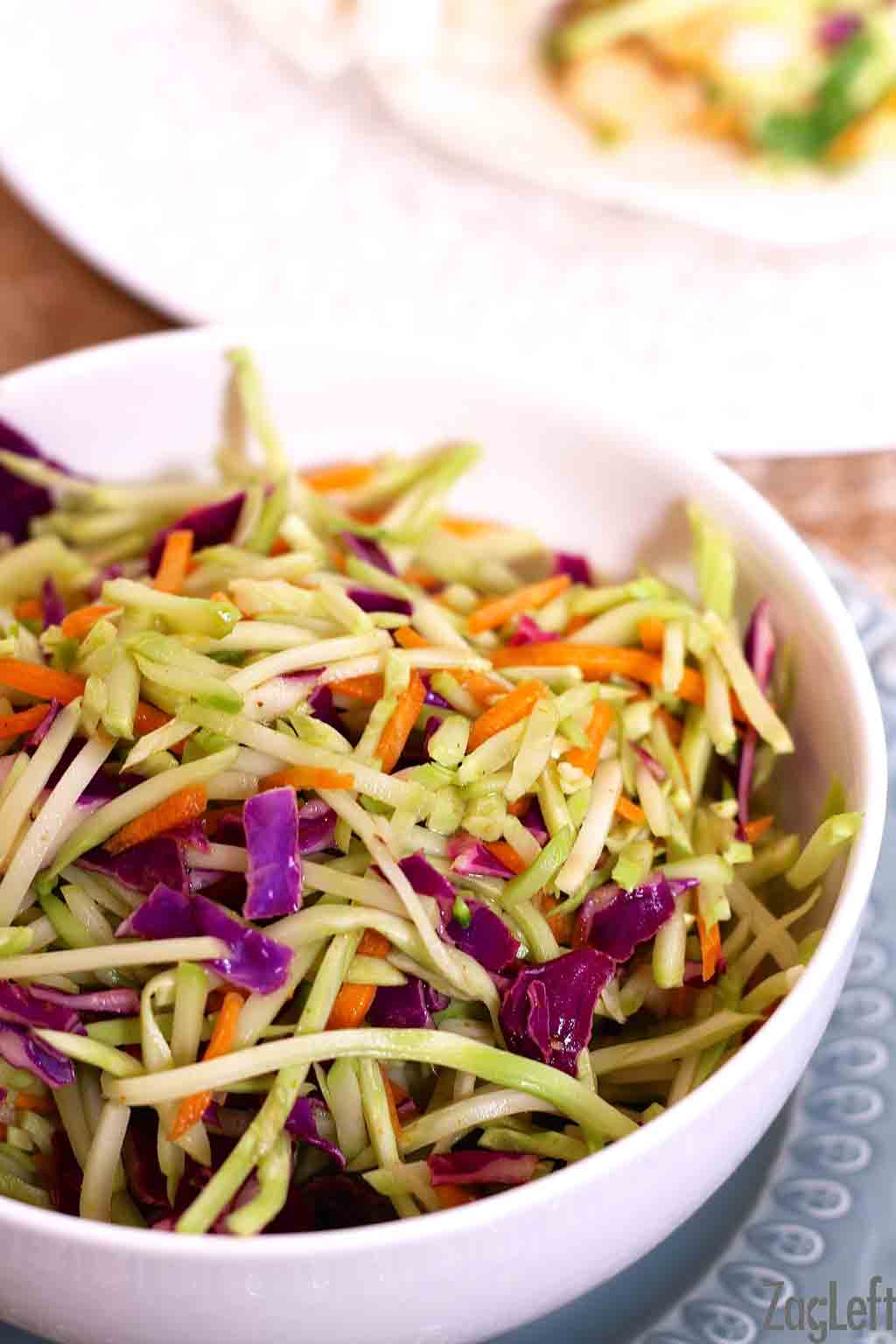a bowl of broccoli slaw which goes on top of a fish taco | One Dish Kitchen