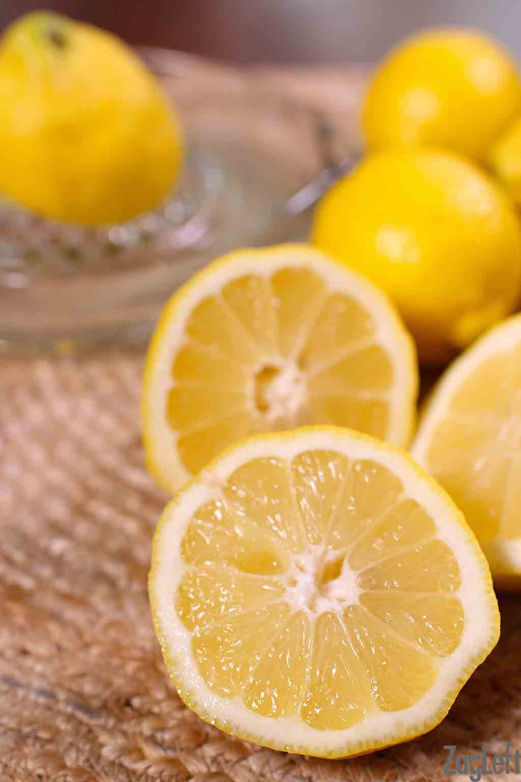 Lemons on a table cut in half