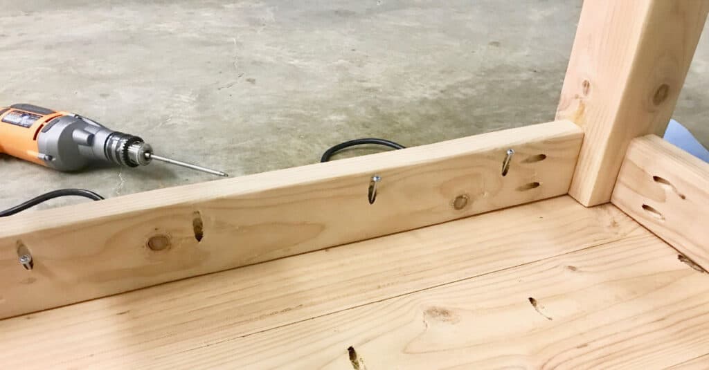 Attaching the table base to the table top.
