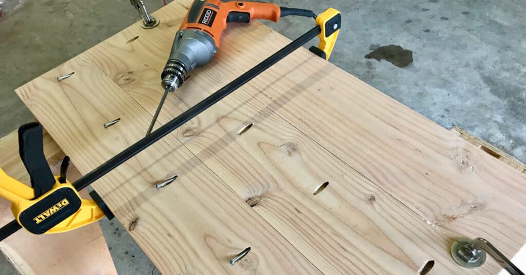 Using a trigger clamp to hold table top boards together.