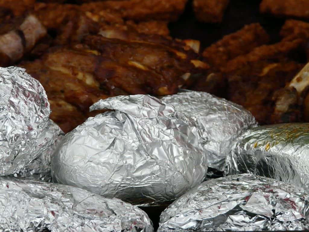potatoes wrapped in foil on grill