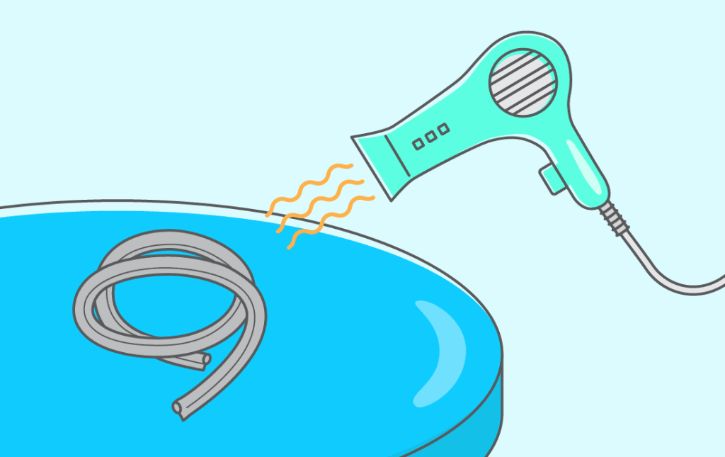 a new door seal being warmed by a hair dryer