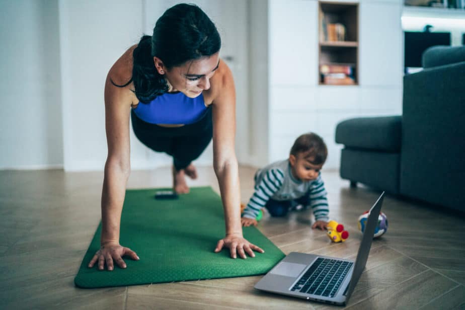 A young mother has an online training at home