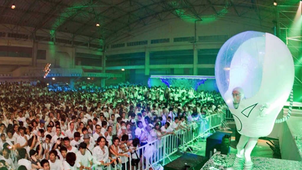 Space bubble performer on stage, entertaining crowd at Sci-Fi event