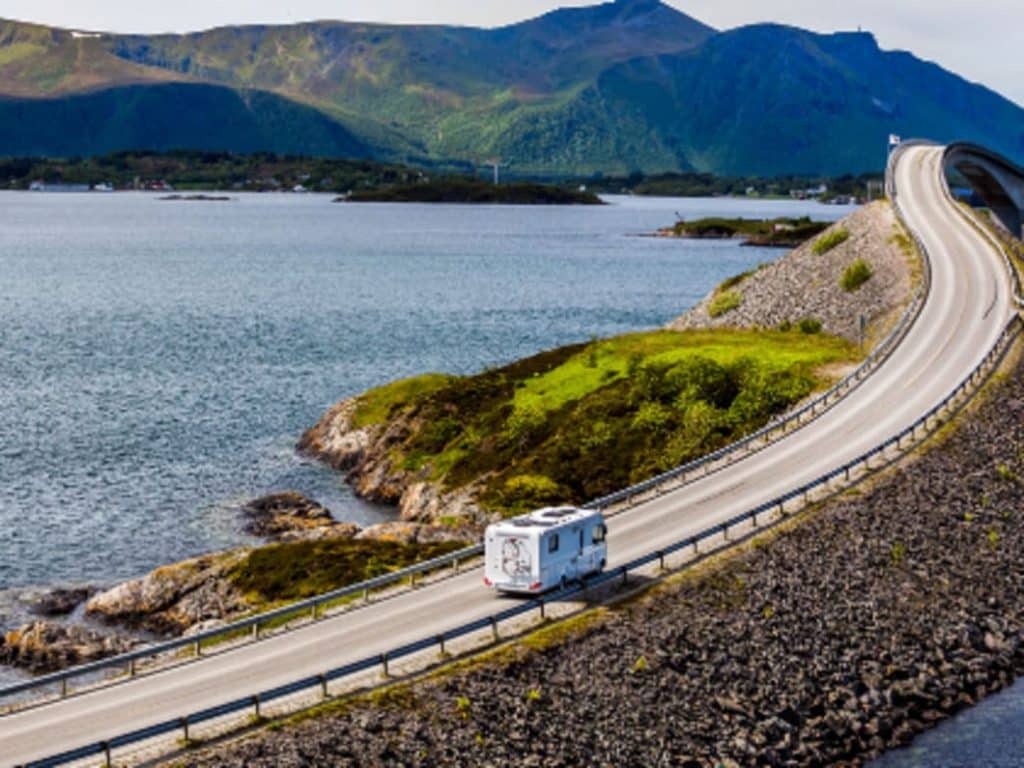 RV traveling on long stretch of road
