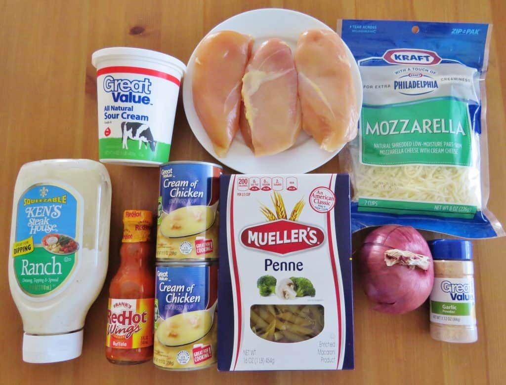chicken breasts, penne pasta, cream of chicken, mozzarella cheese, onion, garlic powder, sour cream, ranch dressing