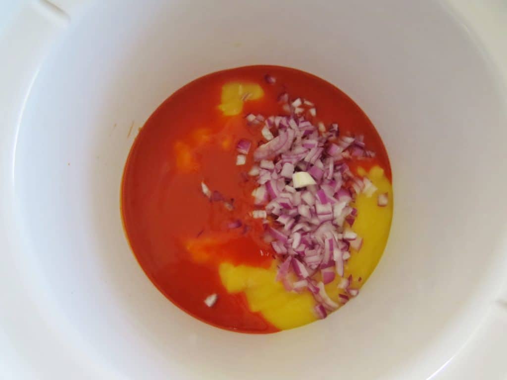 hot sauce, cream of chicken, onion in slow cooker