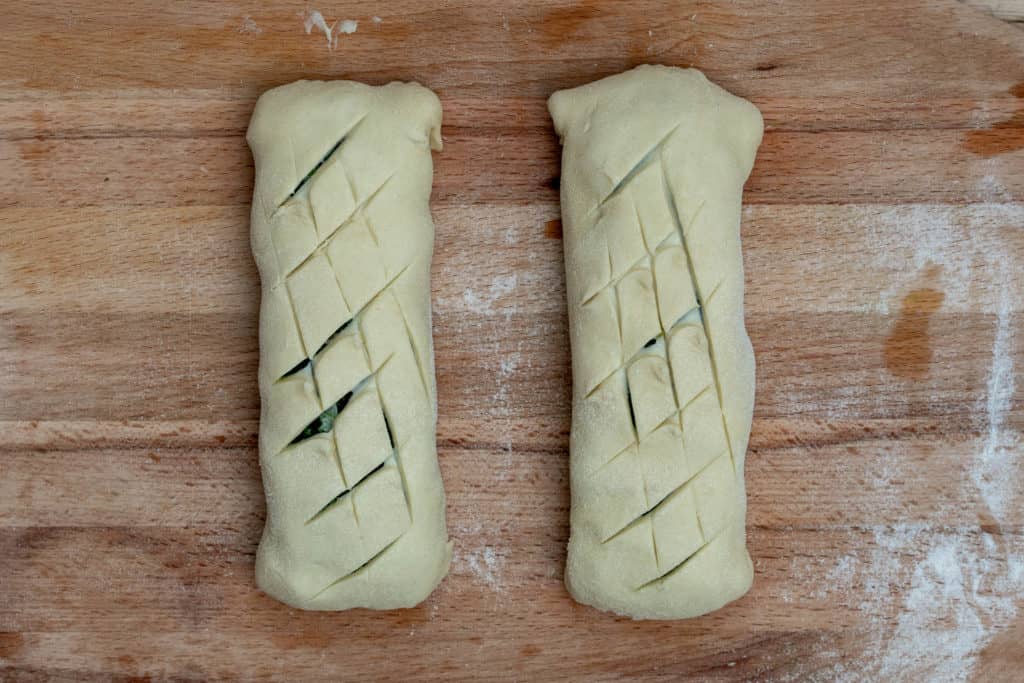 2 salmon wellington puff pastry packets scored