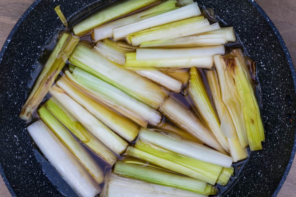 leeks covered in chicken broth