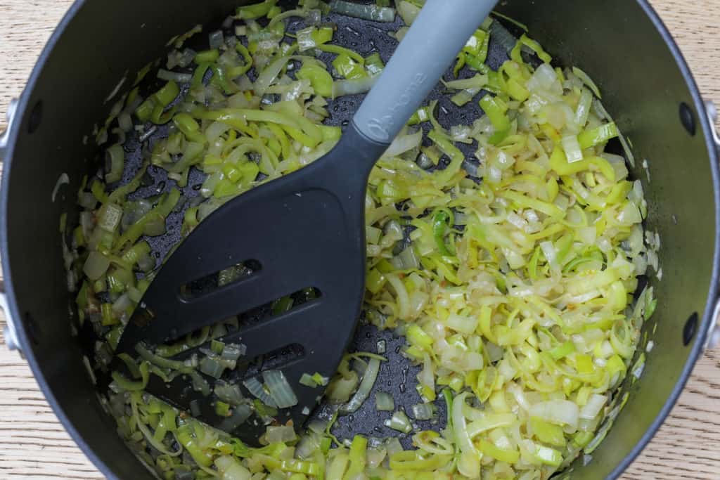 Sautéed leeks, onions, garlic, and miso for vegan potato leek soup