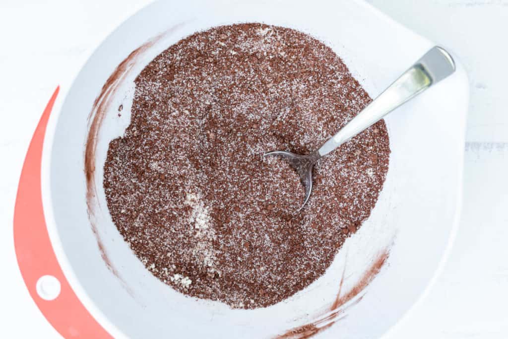 large bowl with almond flour, cocoa powder, sugar, baking powder, and salt