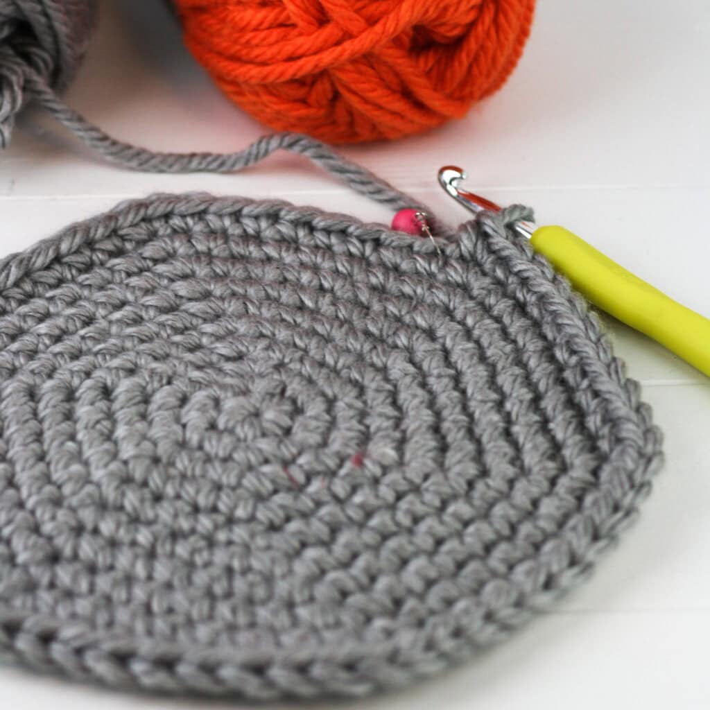 Crochet Dinosaur Basket, the first free pattern in a series of three nesting crochet baskets. Design by Winding Road Crochet. #dinosaur #crochetdinosaur #crochetbasket #crochethomedecor