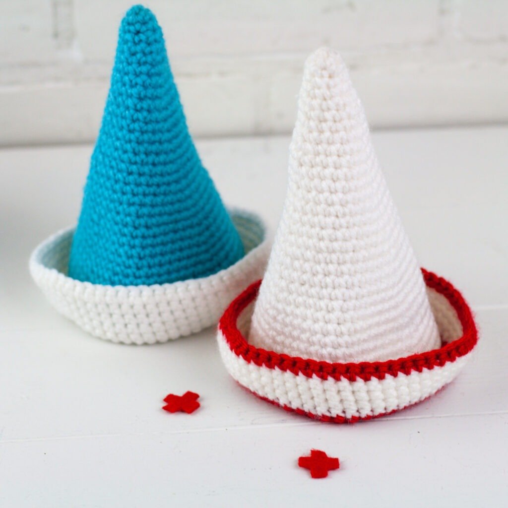 A crochet gnome pattern to honor our everyday heroes. Crochet a doctor and nurse gnome with this free crochet pattern by Winding Road Crochet.